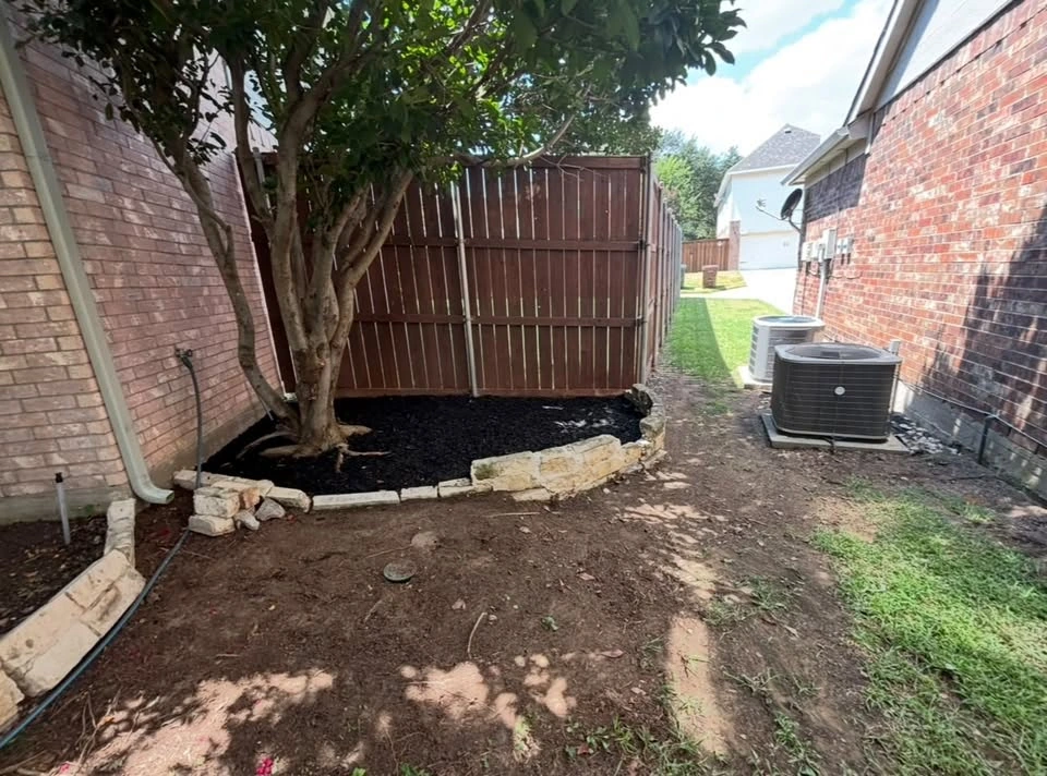 Another view of a cleaned and freshly mulched tree bed