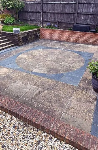 Patio before and after pressure washing before exterior work